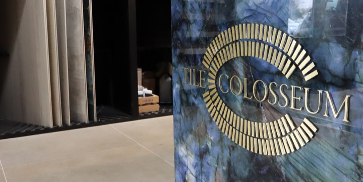 The brass Tile Colosseum mark on blue marble inside the showroom